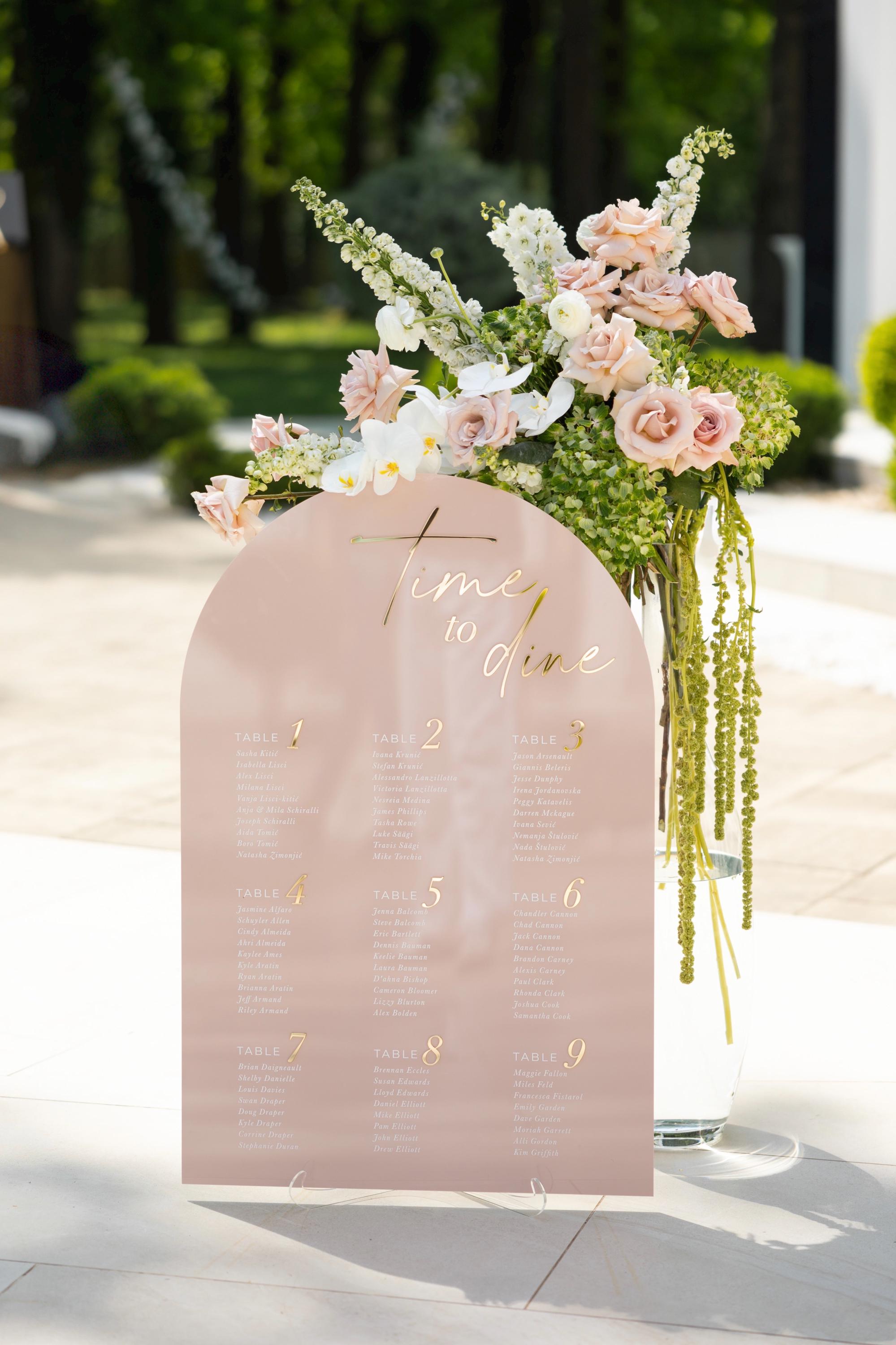 Modern pink acrylic seating chart featuring 3D gold mirror accents
