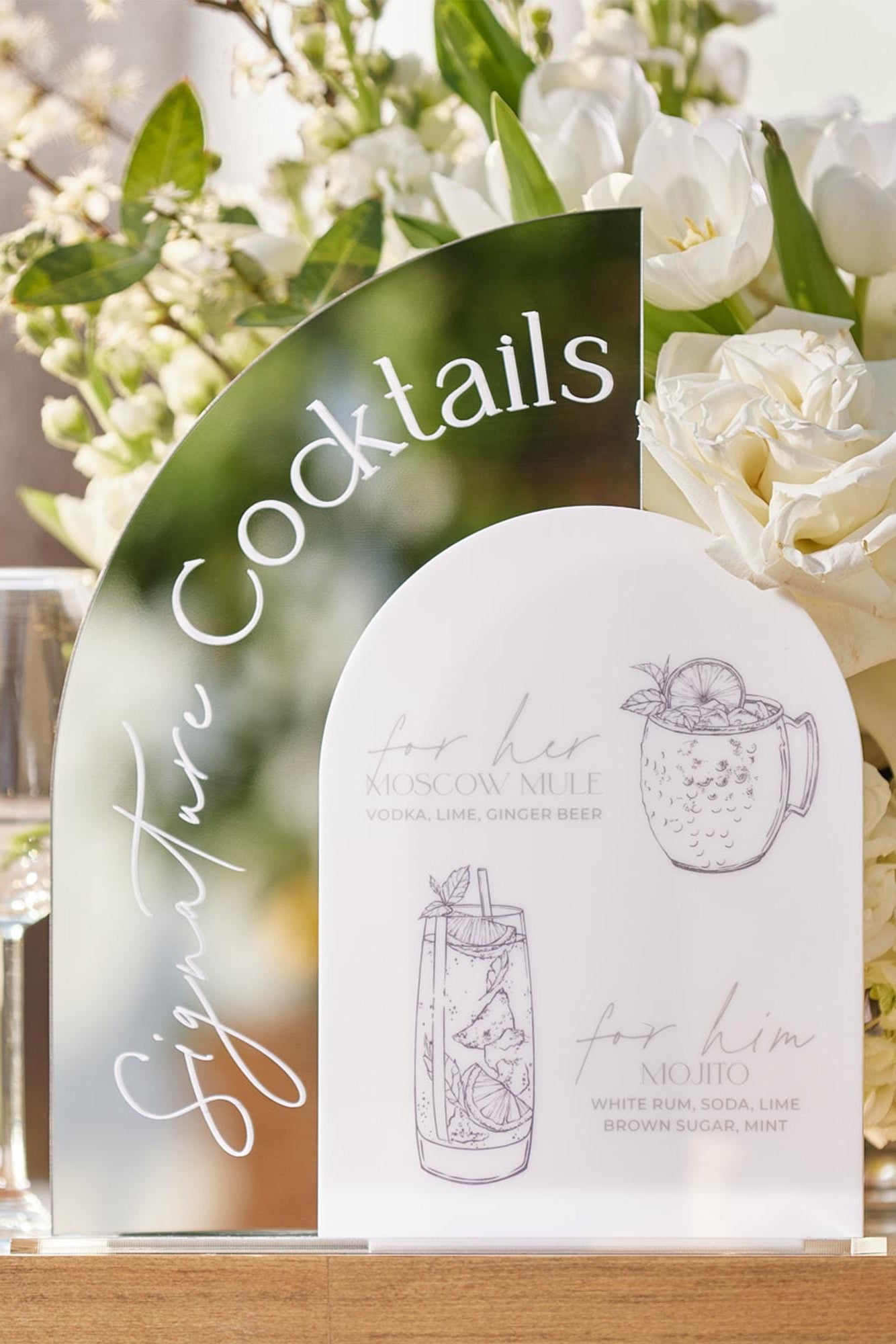 Two-piece signature drink sign set with silver and white arched designs
