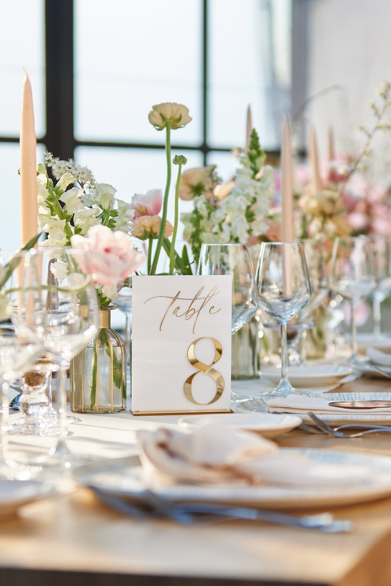 White acrylic wedding table numbers with 3D gold mirror finish for elegant reception table
