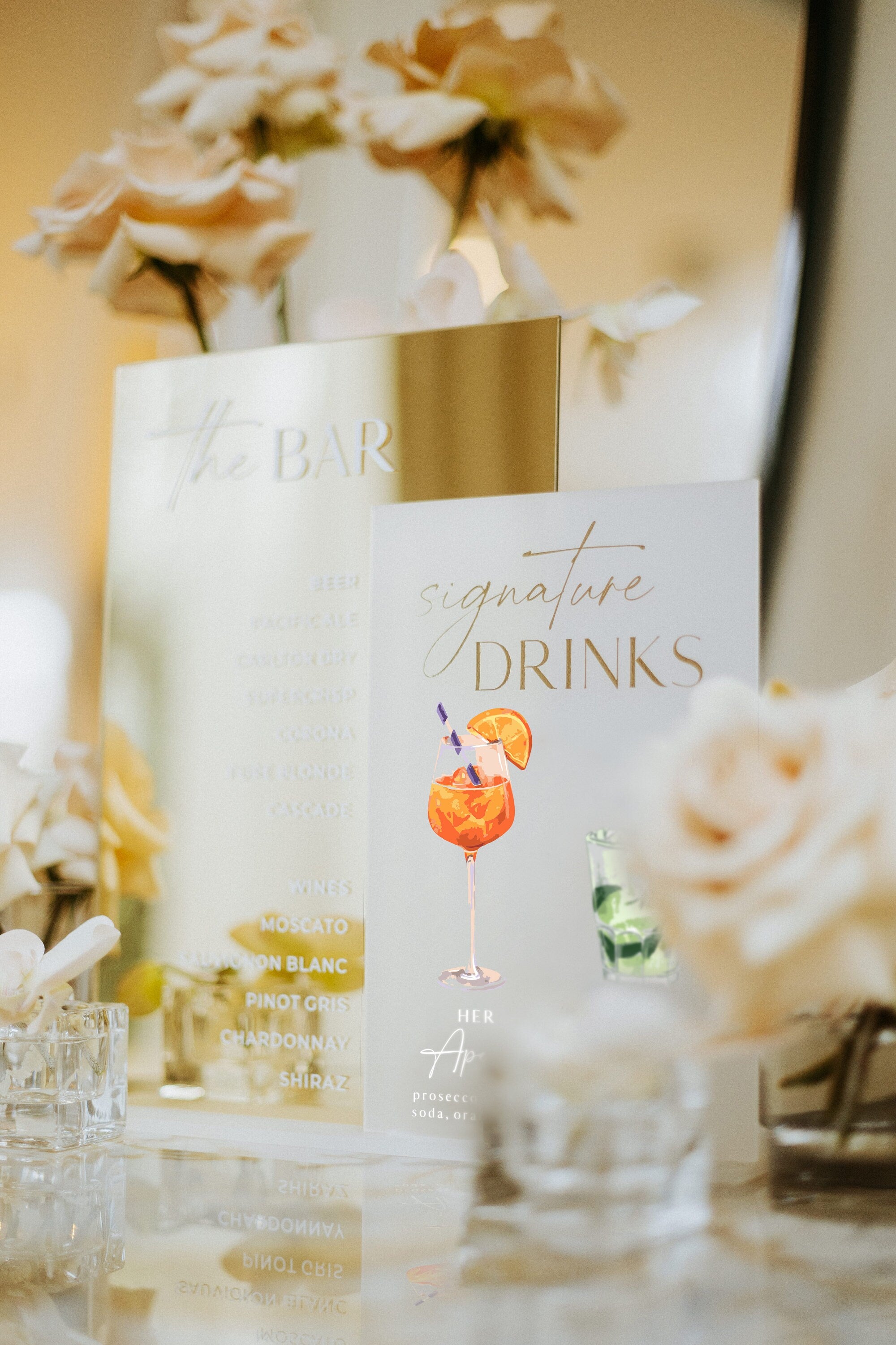 Frosted acrylic signature drinks sign with watercolor his and hers cocktails
