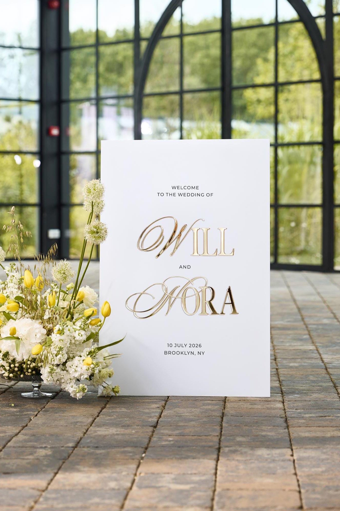 White acrylic wedding welcome sign with 3D gold mirror names for ceremony entrance
