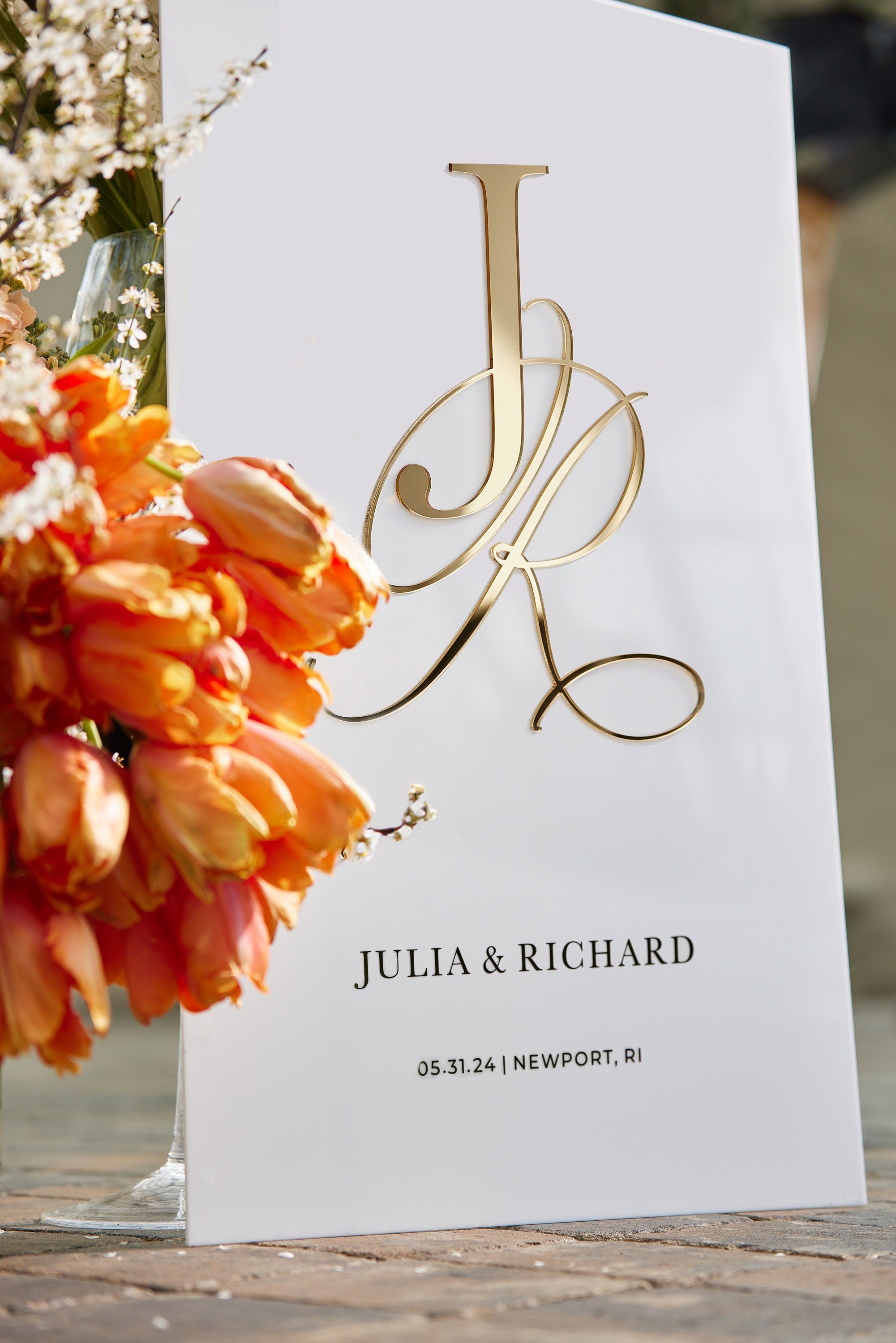 Close-up of white acrylic wedding sign with 3D gold mirror personalized initials
