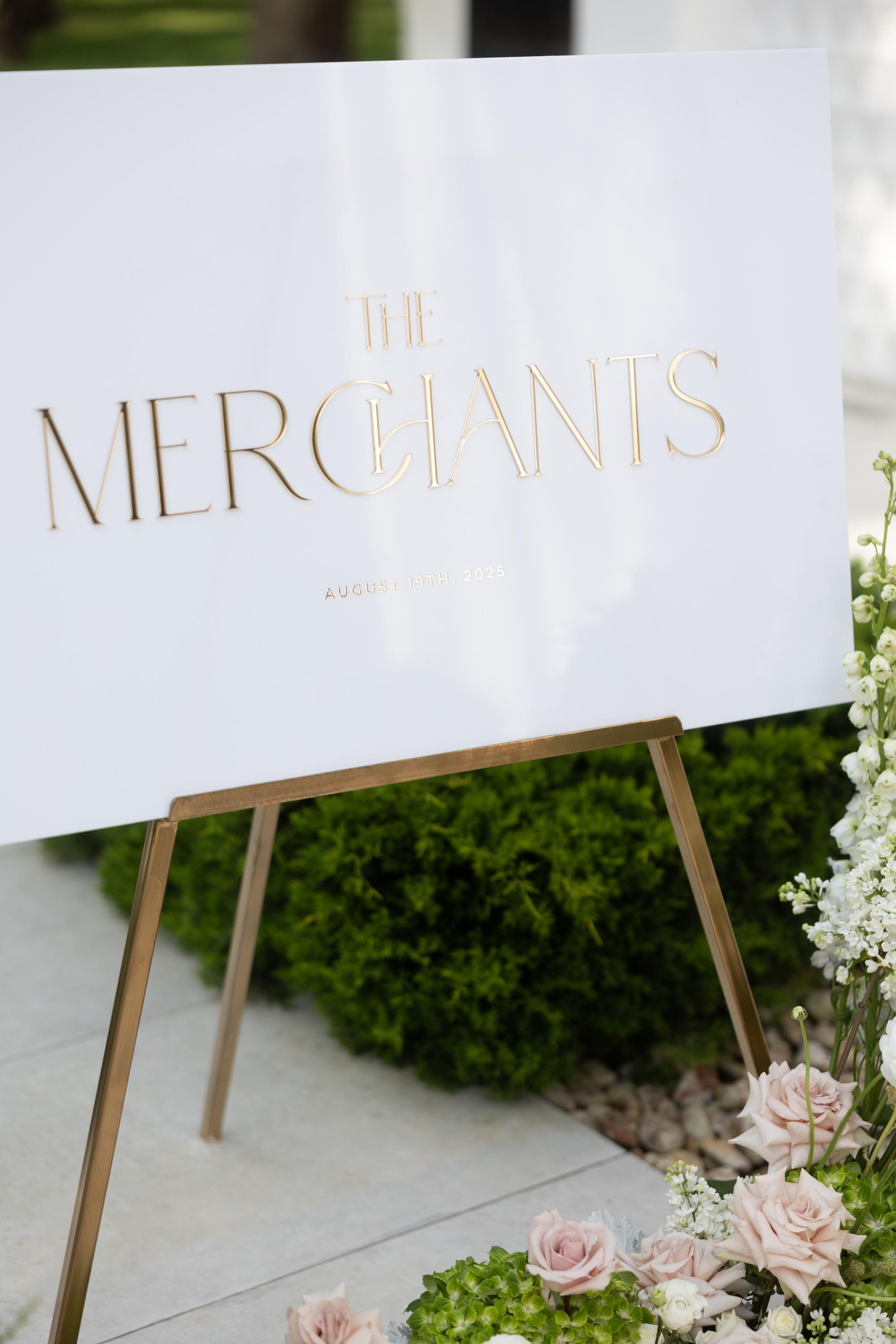 Custom wedding signs featuring raised gold names for a high-end look.
