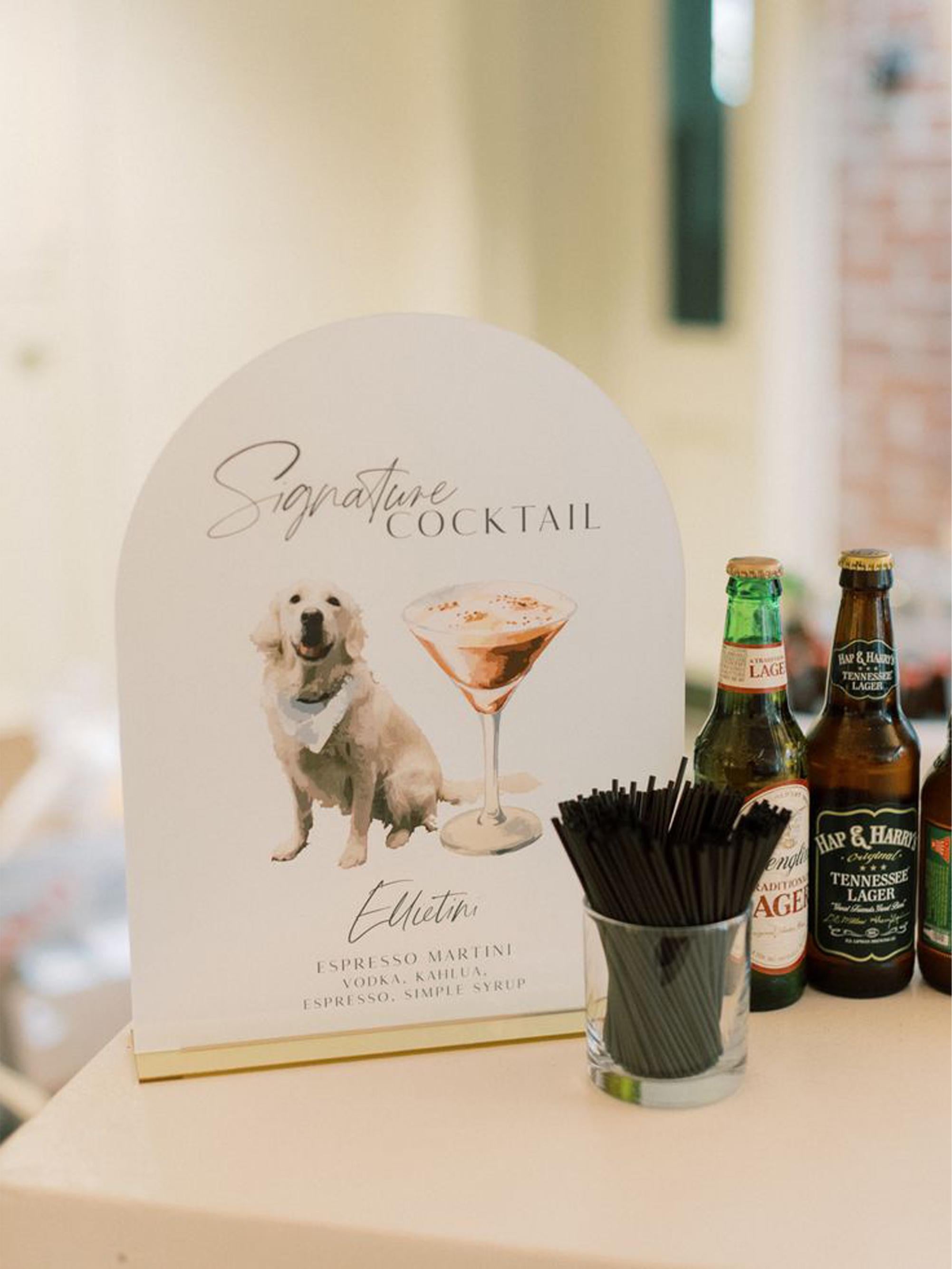 Acrylic wedding bar menu with custom dog portraits and cocktails
