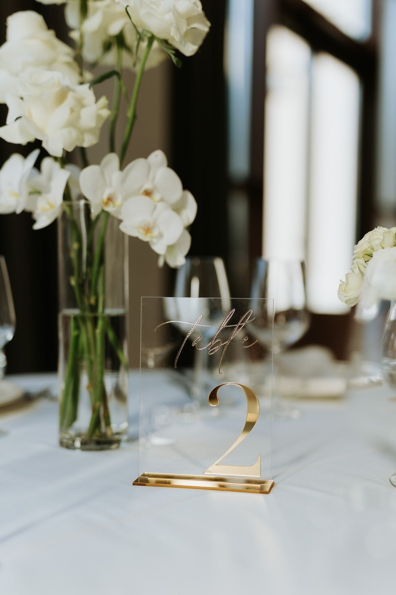 Wedding table number featuring clear acrylic and 3D gold mirror accent
