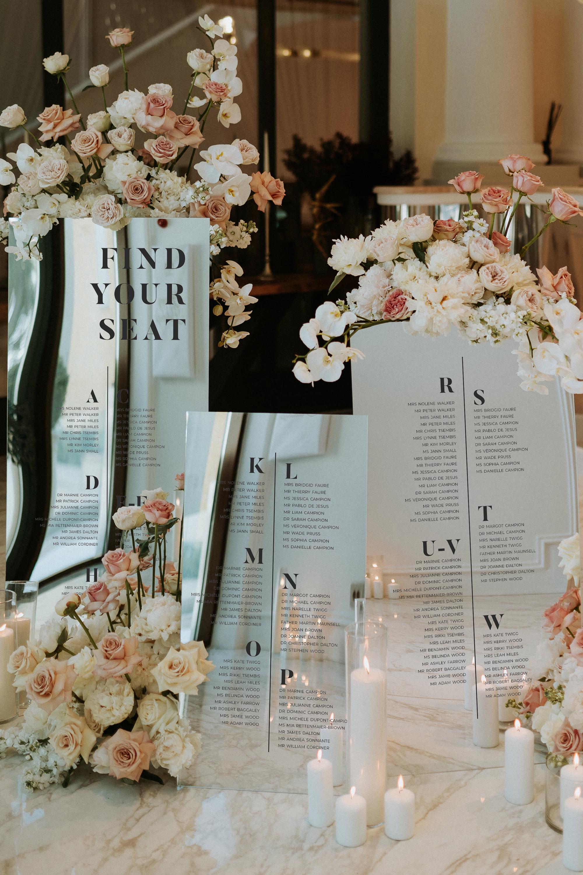Elegant silver mirror acrylic seating plan for wedding table assignments
