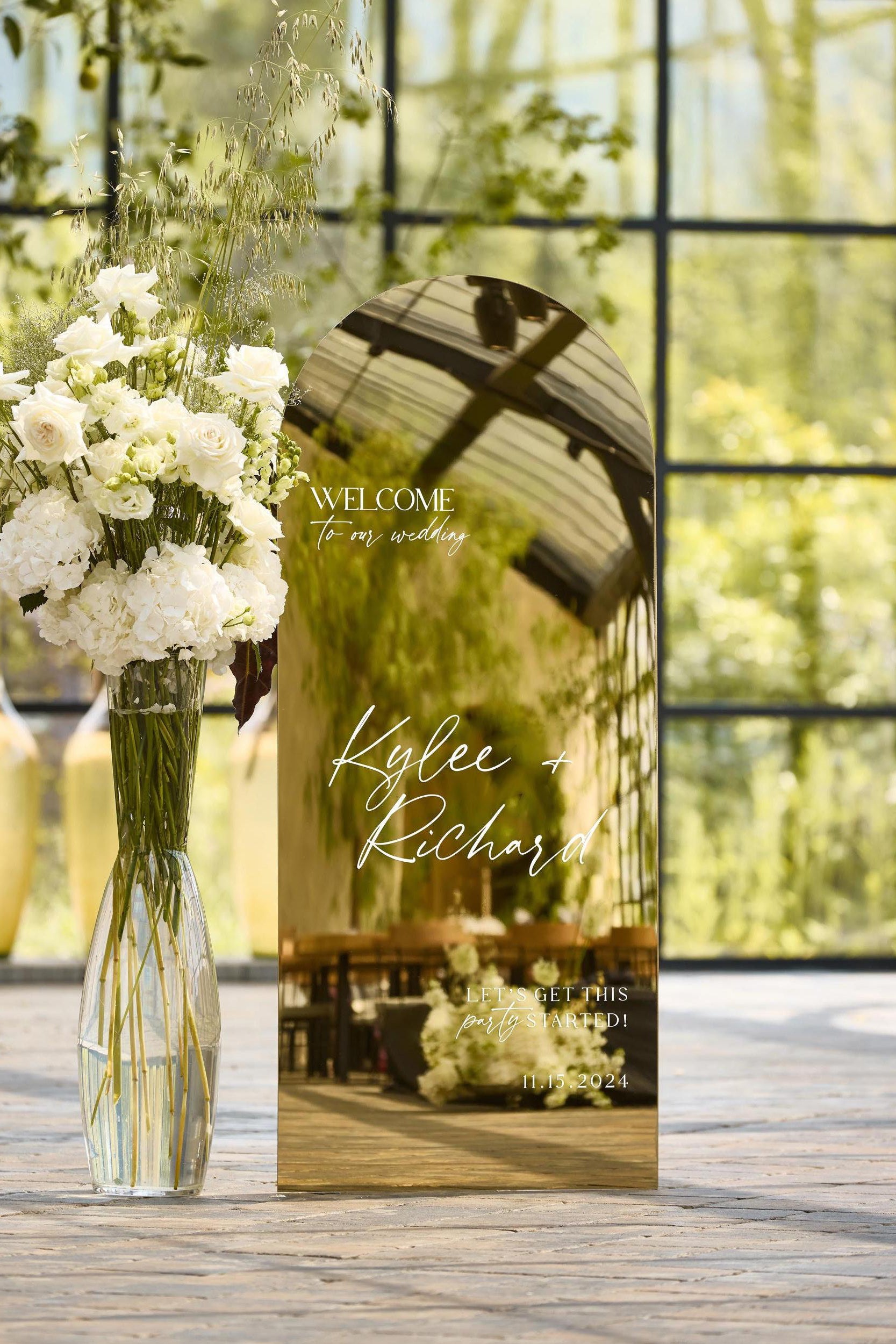 Minimalist Gold Mirror Wedding Welcome Sign with clean centered serif text.
