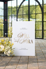 White acrylic reception welcome sign with elegant 3D gold mirror names
