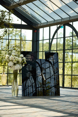 Three black acrylic wedding signs with gold accents for reception decor
