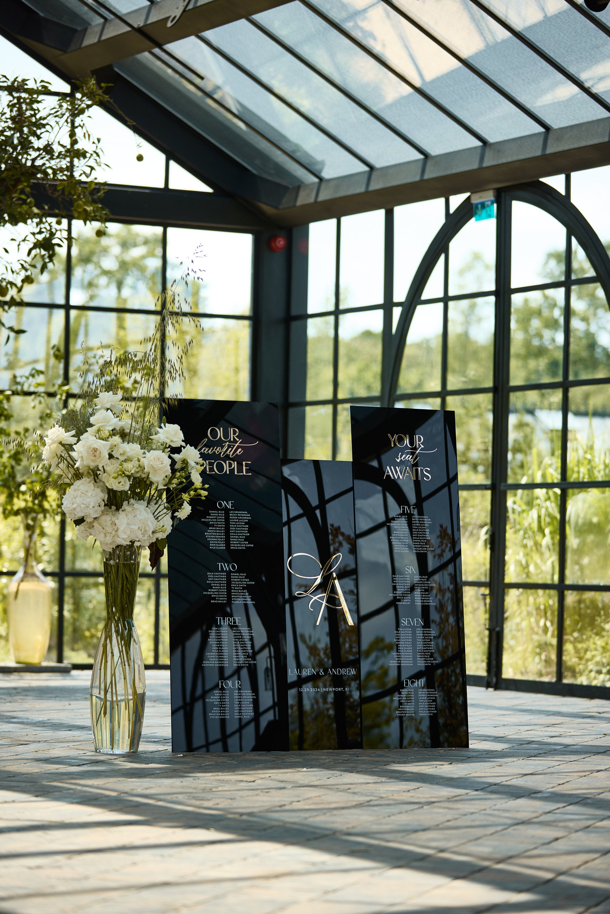 Three black acrylic wedding signs with gold accents for reception decor
