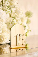 Gold mirror wedding table numbers arched shape with matching stand
