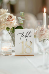 White acrylic wedding table number with 3D gold mirror lettering and gold stand
