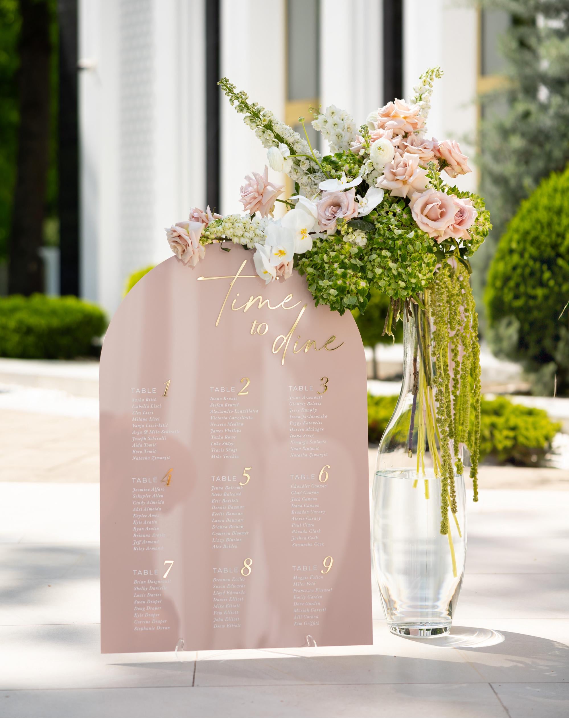 Arched pink acrylic seating chart with 3D gold mirror Time to Dine header
