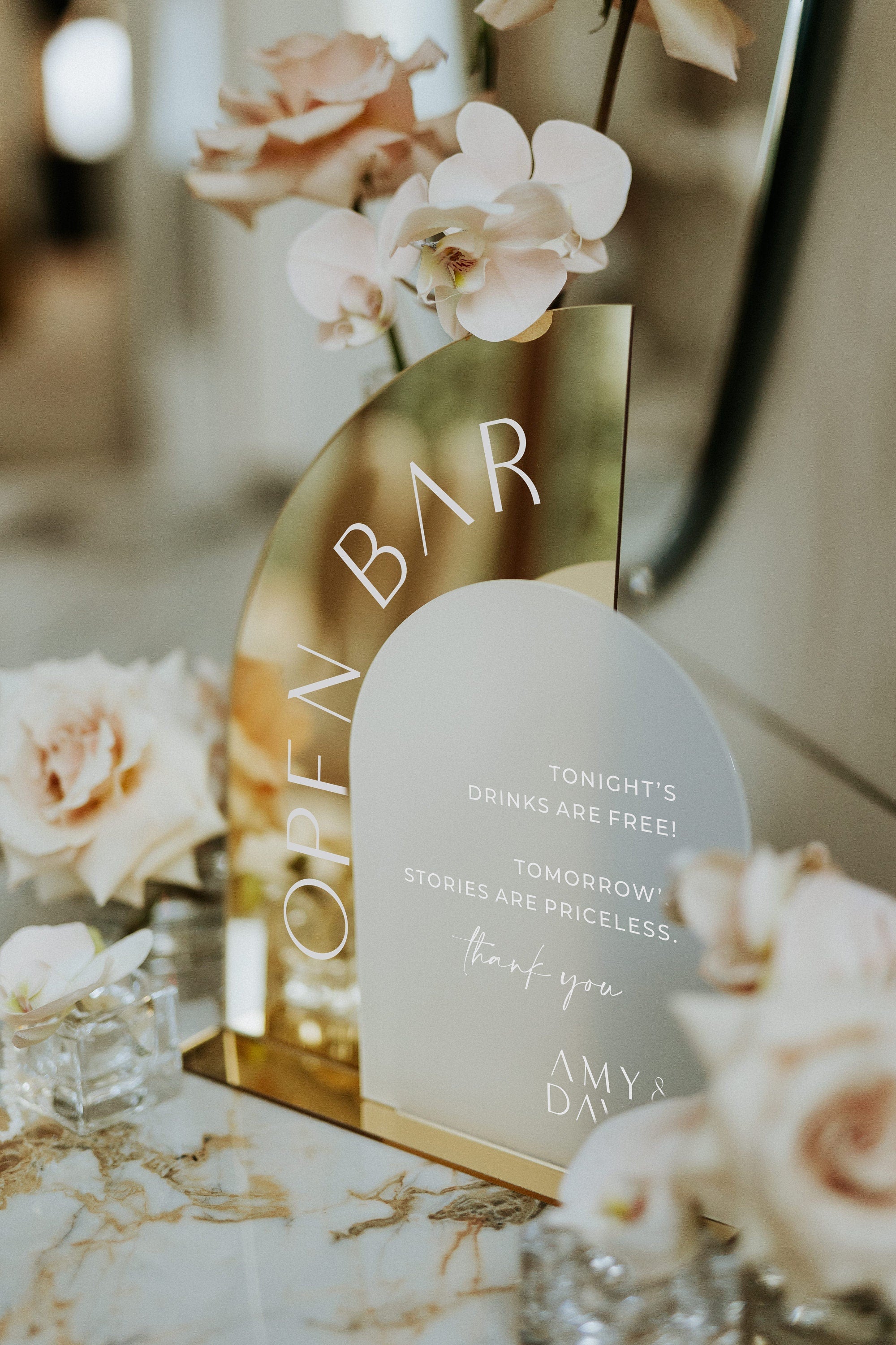 Wedding bar sign with white lettering on frosted acrylic with gold mirror base