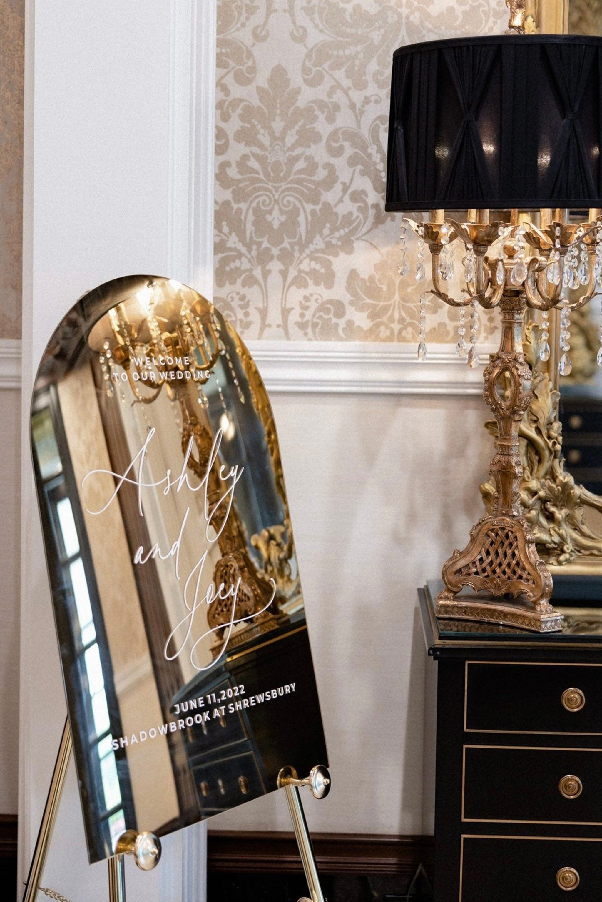  Personalized gold acrylic signage displayed on a gold easel for custom messages.