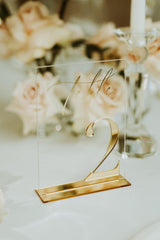 Clear acrylic table number with 3D gold mirror number and gold stand
