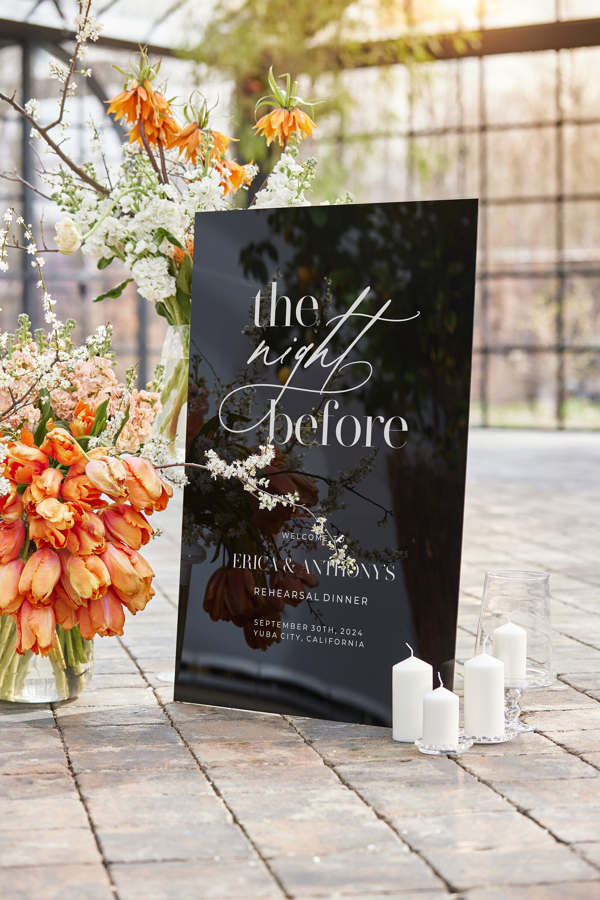 Black acrylic rehearsal dinner sign with The Night Before text and personalized names

