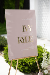 Dusty Pink Wedding Welcome Sign featuring oversized 3D gold mirror names