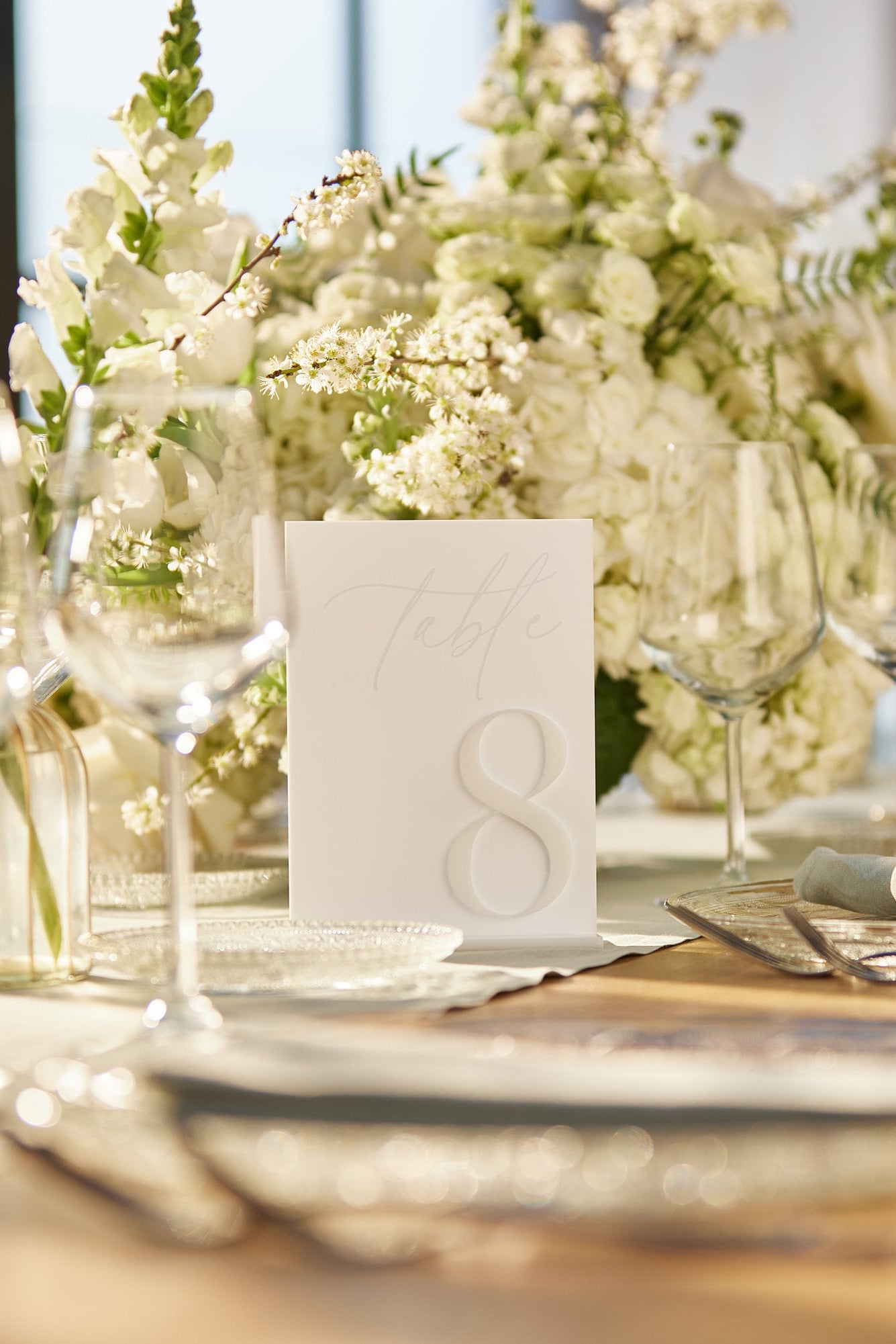Modern white acrylic table sign with 3D number for wedding decor
