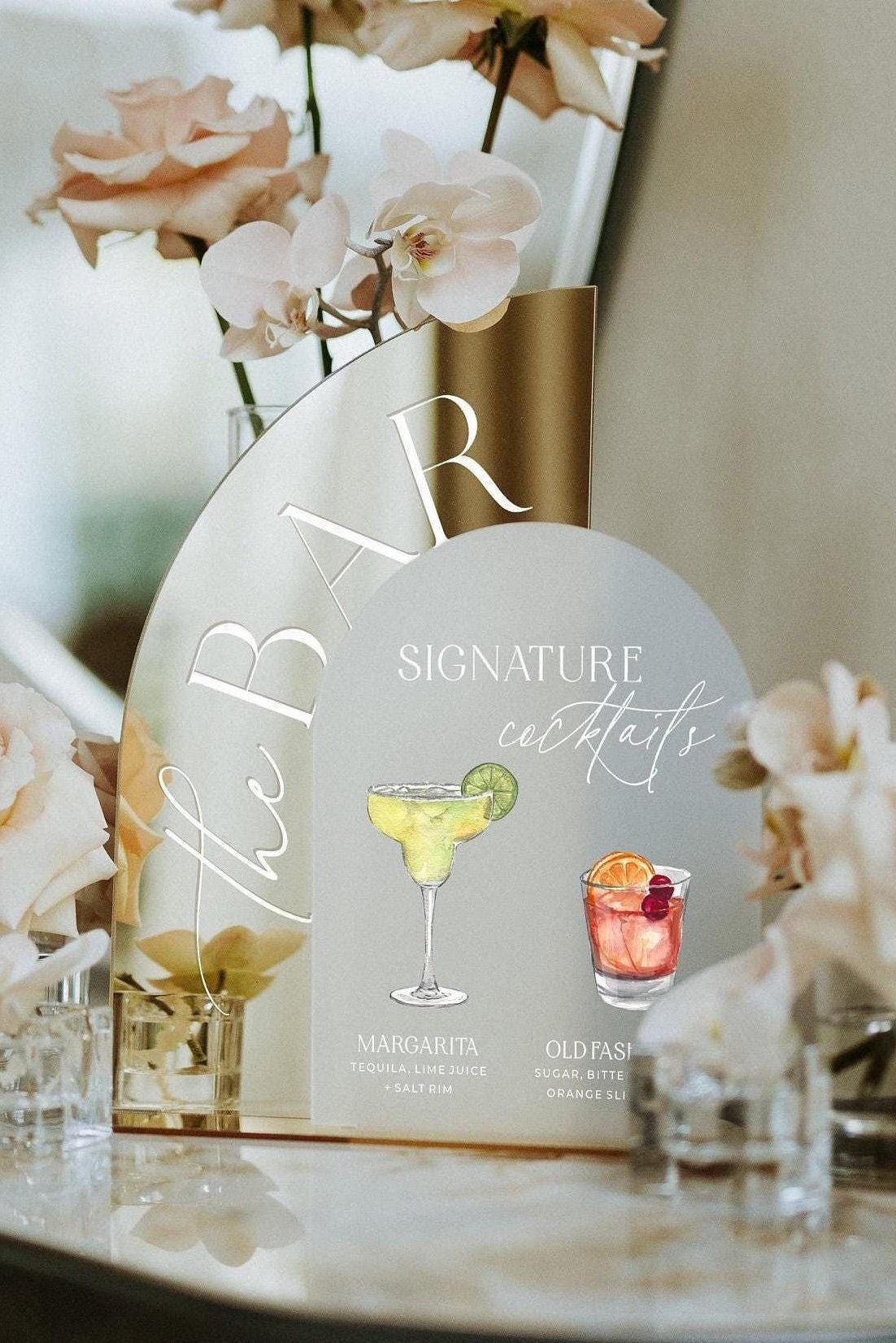 Two-piece signature cocktails sign with gold and frosted arched design
