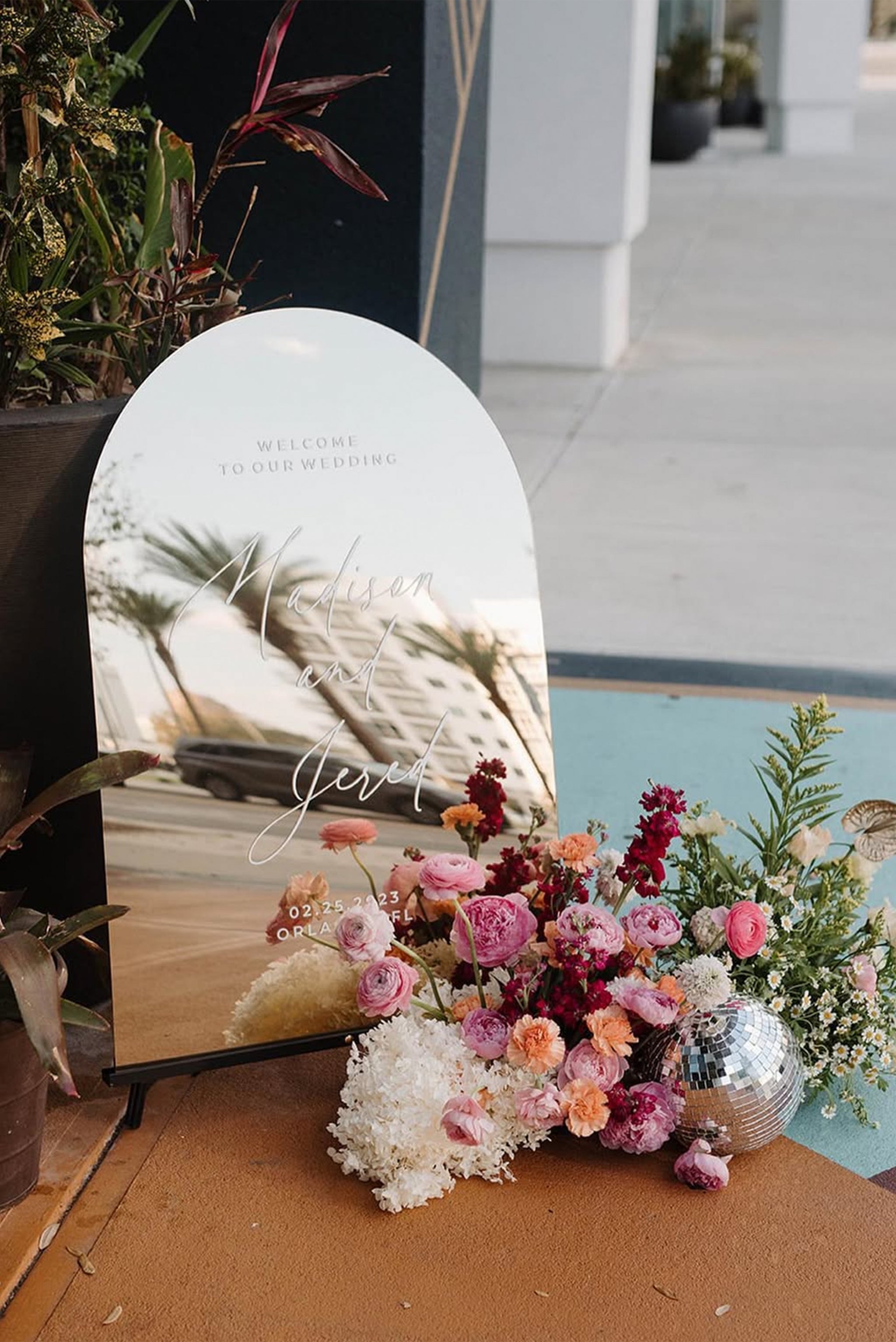 Personalized Arched Gold Mirror Wedding Welcome Sign featuring romantic white calligraphy script.
