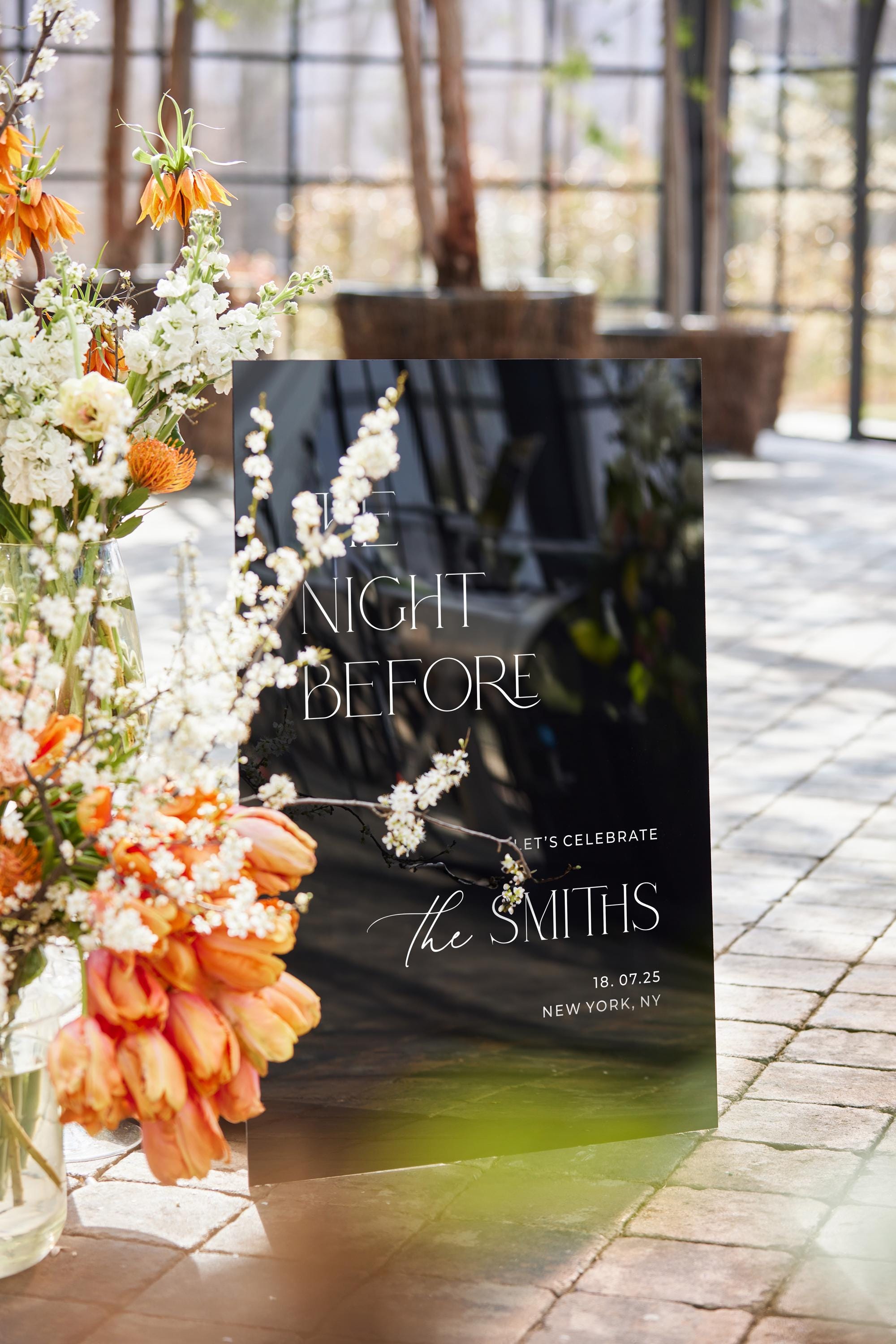 Modern wedding decor displaying The Night Before details on black gloss acrylic material.